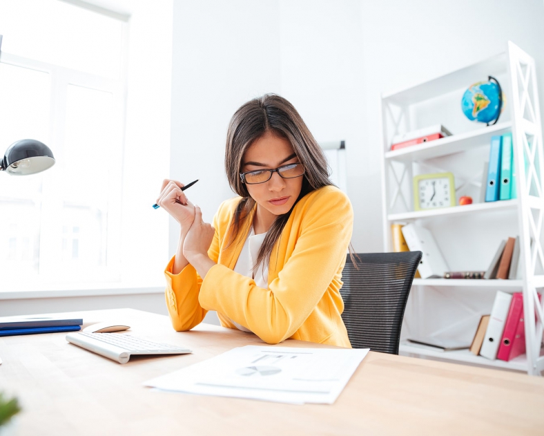 businesswoman-analysing-document-P8WSNMC-min